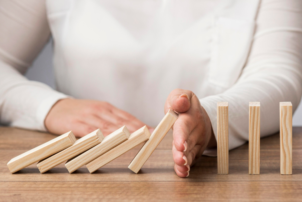 Representation of financial crisis with woman and wood